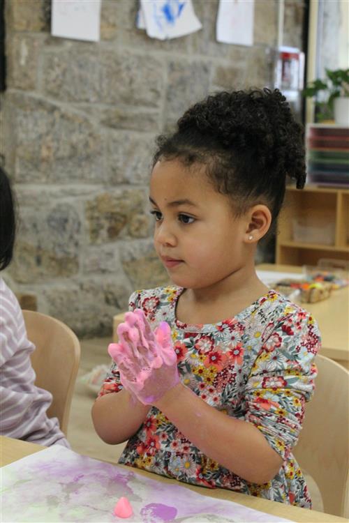 Girl using finger paint